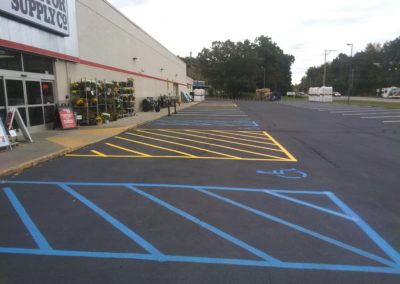 retail store with handicap parking lot design with line striping and painting