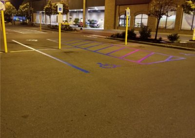 grocery story parking lot line painting and layout example at night